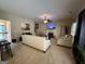 A bright living room features fireplace, TV, neutral walls, and carpet flooring at 3205 Anneewakee Falls Pkwy, Douglasville, GA 30135