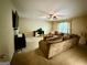 Spacious living room featuring neutral tones, ceiling fan, and lots of natural light at 3205 Anneewakee Falls Pkwy, Douglasville, GA 30135