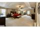 Bright main bedroom with a seating area and neutral carpet creating a cozy and inviting space at 3205 Anneewakee Falls Pkwy, Douglasville, GA 30135