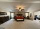 Expansive main bedroom with tray ceiling, a king bed, and lots of natural light at 3205 Anneewakee Falls Pkwy, Douglasville, GA 30135