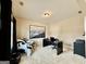 Well-lit home office with carpet, a black desk setup, comfortable chair and natural light from a window at 3205 Anneewakee Falls Pkwy, Douglasville, GA 30135