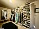 Spacious walk-in closet with lots of shelving and hanging space for optimal organization and storage at 3205 Anneewakee Falls Pkwy, Douglasville, GA 30135