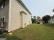 Angle view of the side yard showcasing the home's features at 3205 Anneewakee Falls Pkwy, Douglasville, GA 30135