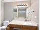 Bathroom with a granite countertop vanity, toilet, and shower over tub at 106 Oakwood Cir, Stockbridge, GA 30281
