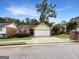 A charming one-story brick home with a well-maintained lawn on a tree-lined street at 106 Oakwood Cir, Stockbridge, GA 30281