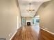 Bright living room with vaulted ceilings, fireplace, wood floors, and large windows at 106 Oakwood Cir, Stockbridge, GA 30281