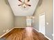 Bright living room with vaulted ceilings and wood floors leading to the front entrance at 106 Oakwood Cir, Stockbridge, GA 30281