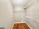 Spacious walk-in closet featuring wire shelving and hardwood flooring, perfect for organized storage solutions at 106 Oakwood Cir, Stockbridge, GA 30281