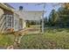 Inviting backyard with a pergola-covered patio and a well-maintained lawn, perfect for outdoor activities at 100 Clydesdale Ct, Tyrone, GA 30290