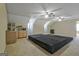 Finished basement featuring unique platform seating, a kitchenette area, and recessed lighting at 100 Clydesdale Ct, Tyrone, GA 30290