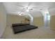 Finished basement showcasing a spacious layout, platform seating, a kitchenette, and bright recessed lights at 100 Clydesdale Ct, Tyrone, GA 30290
