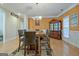 Inviting dining room with hardwood flooring, chair-rail molding, and a modern chandelier at 100 Clydesdale Ct, Tyrone, GA 30290