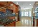 Open kitchen with granite countertops, stainless steel appliances, and breakfast nook at 100 Clydesdale Ct, Tyrone, GA 30290