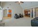 Living room with vaulted ceilings connects to the dining room and kitchen at 100 Clydesdale Ct, Tyrone, GA 30290