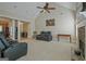 The living room has vaulted ceilings and opens to other rooms at 100 Clydesdale Ct, Tyrone, GA 30290