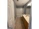 Bathroom featuring vanity with laminate countertops, neutral paint, and a tub-shower at 106 Ne Ellis Dr # 106, Conyers, GA 30012