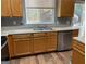 Functional kitchen features ample countertop space, stainless steel appliances, and natural wood cabinets at 106 Ne Ellis Dr # 106, Conyers, GA 30012
