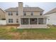 Lawn view featuring a screened-in porch and ample outdoor space at 3338 Gardenside Walk, Loganville, GA 30052