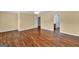 A spacious bedroom with hardwood flooring and view to a bathroom and another room at 3338 Gardenside Walk, Loganville, GA 30052
