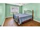 Comfortable bedroom features wood floors, a window, and a ceiling fan at 3338 Gardenside Walk, Loganville, GA 30052