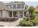 Charming home entrance with manicured landscaping, stone accents, and a welcoming front porch at 3338 Gardenside Walk, Loganville, GA 30052