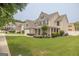 Lovely two-story home with a green lawn and inviting curb appeal in a neighborhood setting at 3338 Gardenside Walk, Loganville, GA 30052