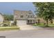 Well-maintained two-story home boasting a spacious driveway and beautifully landscaped front yard at 3338 Gardenside Walk, Loganville, GA 30052