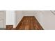 Hallway with hardwood flooring leading to other rooms at 3338 Gardenside Walk, Loganville, GA 30052