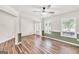 Bright living room with durable floors, natural light, and a modern ceiling fan at 3338 Gardenside Walk, Loganville, GA 30052