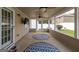 Relaxing sunroom with ceiling fans, TV, and access to backyard at 3338 Gardenside Walk, Loganville, GA 30052