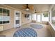 Cozy sunroom featuring neutral tones, ceiling fans, and ample natural light at 3338 Gardenside Walk, Loganville, GA 30052