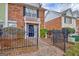Charming brick townhouse with a landscaped front yard and inviting entryway at 498 N Jeff Davis Dr, Fayetteville, GA 30214