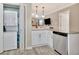 Kitchenette area featuring stacked washer/dryer with adjacent eat-in breakfast bar seating at 498 N Jeff Davis Dr, Fayetteville, GA 30214