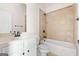 Bathroom features a white vanity and a tiled shower-tub combination at 6857 Louis Dr, Locust Grove, GA 30248