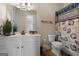 Full bathroom featuring a single sink vanity and a seashell themed shower curtain at 6857 Louis Dr, Locust Grove, GA 30248