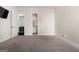 Spacious bedroom featuring plush carpet and a view to an ensuite bathroom at 6857 Louis Dr, Locust Grove, GA 30248