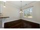 Bright dining area featuring hardwood floors and a modern chandelier at 6857 Louis Dr, Locust Grove, GA 30248
