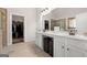 Main bathroom featuring dual sinks and a stand up glass shower at 6857 Louis Dr, Locust Grove, GA 30248