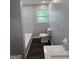 Bathroom featuring new toilet, tiled shower and vanity at 125 Lafayette Dr, Fayetteville, GA 30214