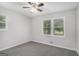 Bedroom featuring neutral carpet and large windows at 125 Lafayette Dr, Fayetteville, GA 30214