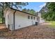 Angle view of a white brick home featuring multiple windows and a classic chimney at 125 Lafayette Dr, Fayetteville, GA 30214