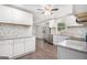 Bright kitchen featuring white cabinets, stainless steel appliances, and granite countertops at 125 Lafayette Dr, Fayetteville, GA 30214