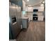 Bright kitchen with stainless steel appliances, granite countertops, and white cabinetry at 125 Lafayette Dr, Fayetteville, GA 30214