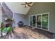 View of the back porch featuring an outdoor gas grill, fireplace and sliding glass doors at 319 Beaconsfield Dr, Sharpsburg, GA 30277
