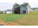 Large backyard with a covered deck and expansive lawn at 319 Beaconsfield Dr, Sharpsburg, GA 30277