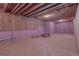 Unfinished basement with exposed ceiling and pink insulation, ready for customization at 319 Beaconsfield Dr, Sharpsburg, GA 30277