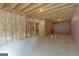 Large unfinished basement area with exposed ceiling and insulation at 319 Beaconsfield Dr, Sharpsburg, GA 30277