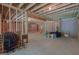 Spacious unfinished basement with exposed beams and ample storage space at 319 Beaconsfield Dr, Sharpsburg, GA 30277