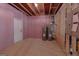 Unfinished basement includes utilities like water heaters and electrical panels at 319 Beaconsfield Dr, Sharpsburg, GA 30277