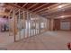 Partially framed basement with visible pipes and an unfinished floor at 319 Beaconsfield Dr, Sharpsburg, GA 30277